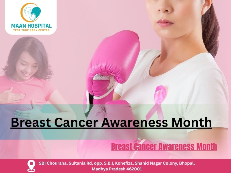 Women promoting Breast Cancer Awareness Month at Maan Hospital Bhopal, wearing pink ribbon and boxing gloves.